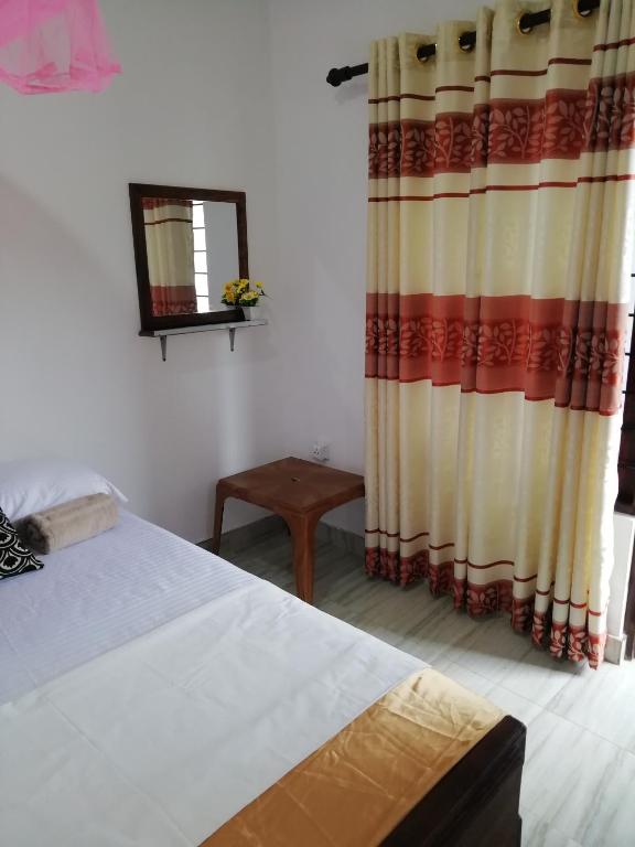 Postel nebo postele na pokoji v ubytování BAS Home Stay