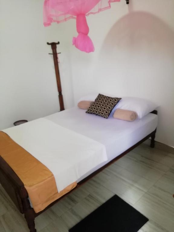 Postel nebo postele na pokoji v ubytování BAS Home Stay