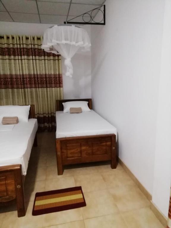 Postel nebo postele na pokoji v ubytování BAS Home Stay