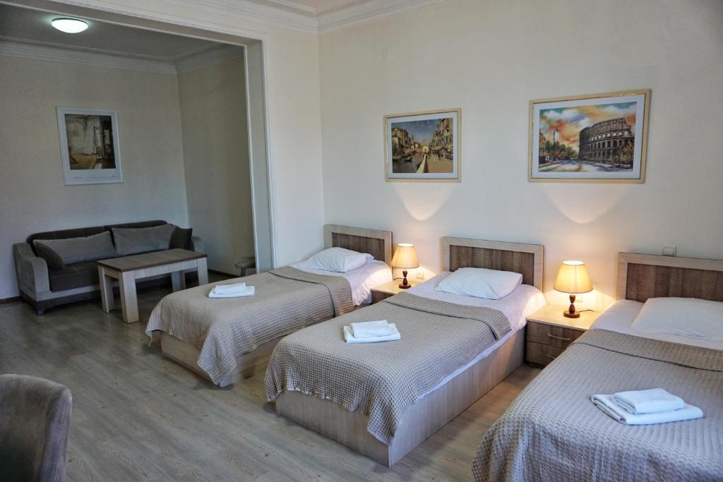 Postel nebo postele na pokoji v ubytování Hotel Mireosi