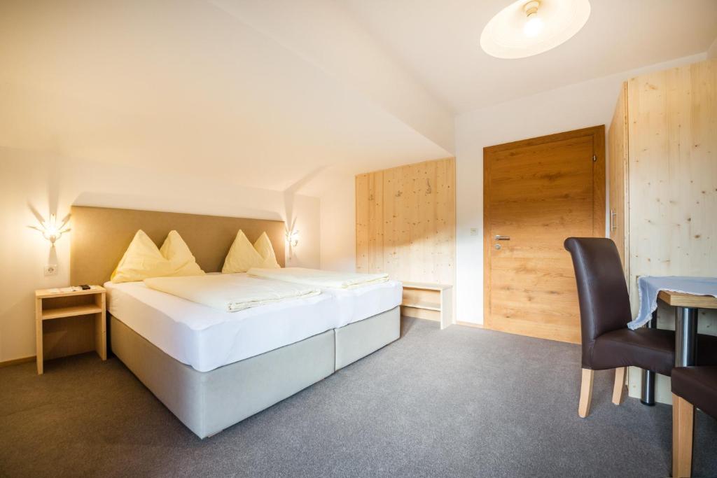 Postel nebo postele na pokoji v ubytování Haus Alpenland