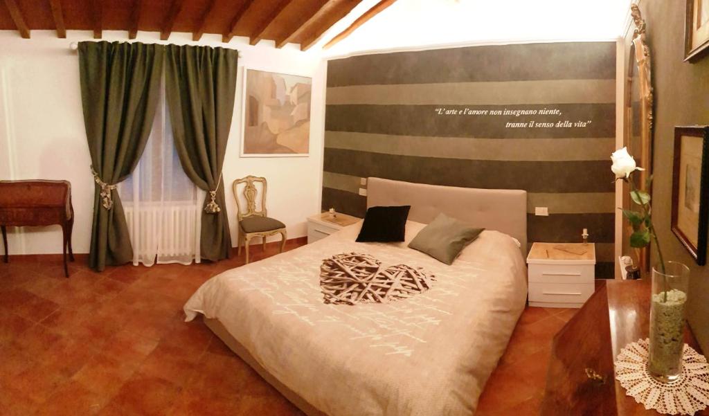 a bedroom with a large bed in a room at La Suite dei Ricordi in Impruneta