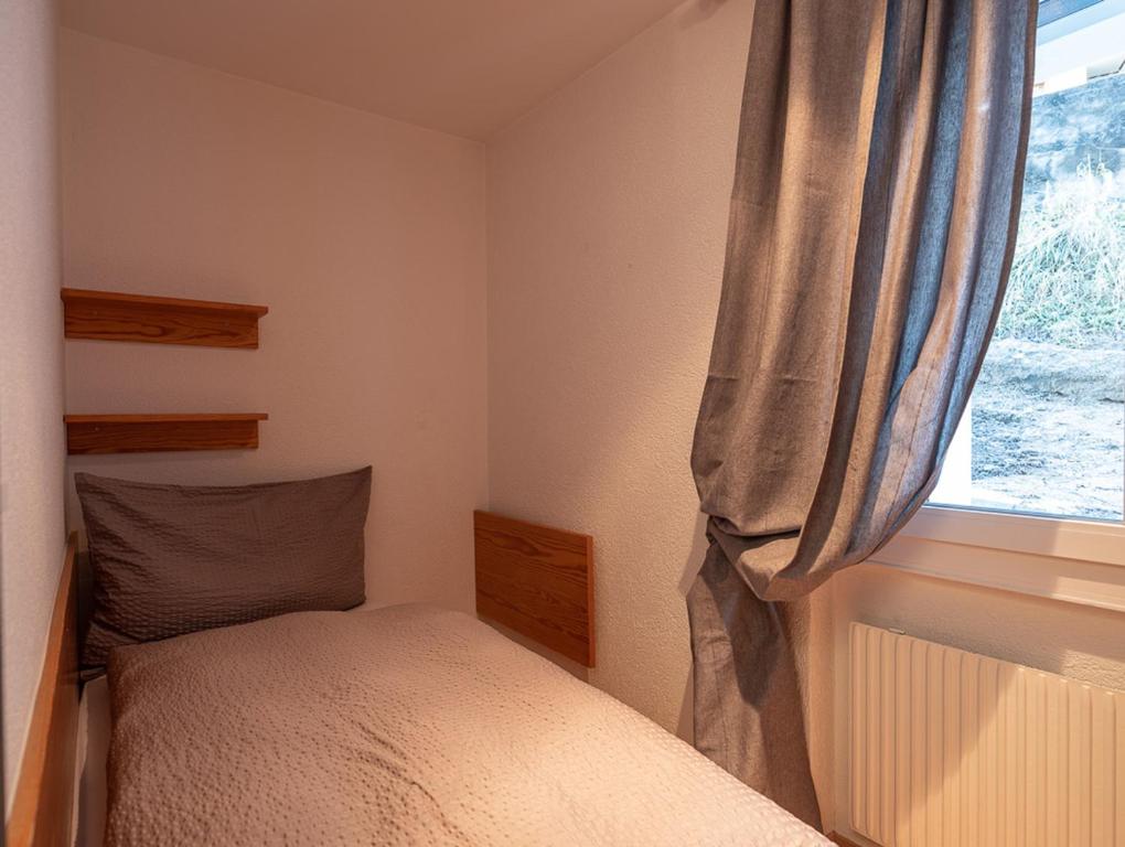 Postel nebo postele na pokoji v ubytování Malteserhaus Zermatt