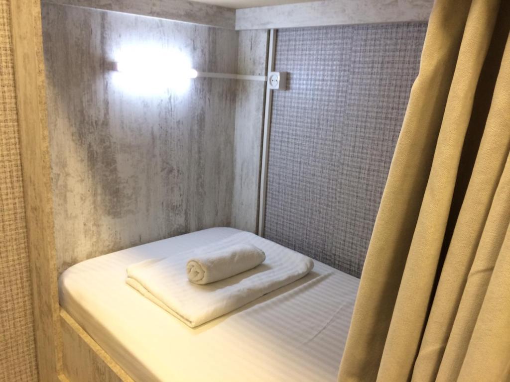 Postel nebo postele na pokoji v ubytování Legvi hostel