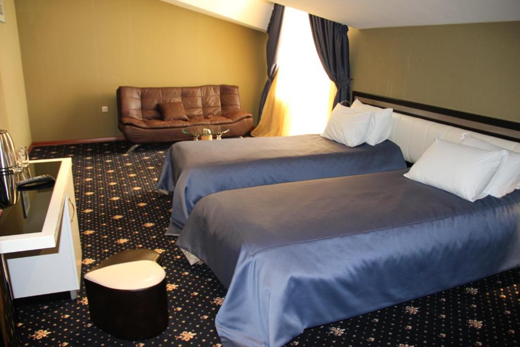 Postel nebo postele na pokoji v ubytování Hotel Villa Palace