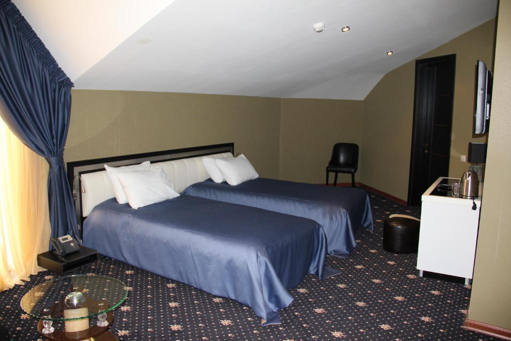 Postel nebo postele na pokoji v ubytování Hotel Villa Palace