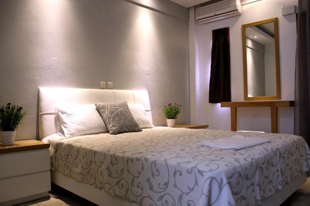 Postel nebo postele na pokoji v ubytování Zeus Hotel