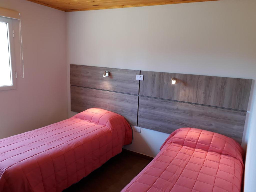 Postel nebo postele na pokoji v ubytování Aluminé Cabañas