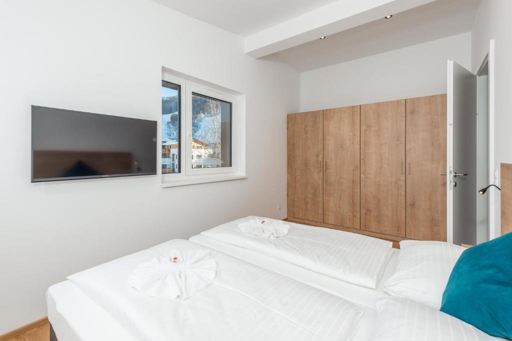 Postel nebo postele na pokoji v ubytování Deluxe Appartement Berglust