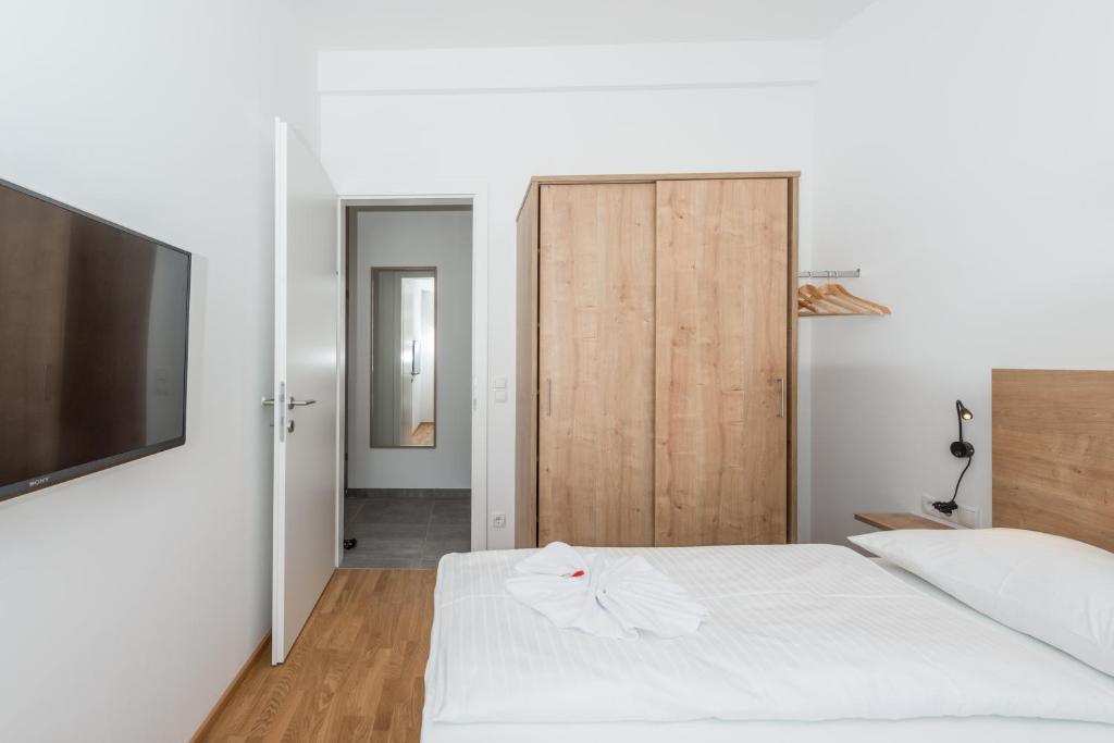 Postel nebo postele na pokoji v ubytování Deluxe Appartement Berglust