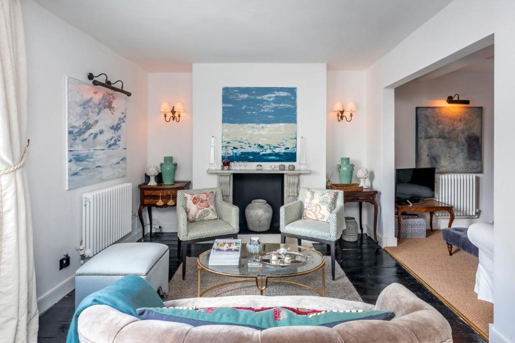 a living room with a couch and a table at Stylish & Spacious City Center Georgian Townhouse in Bath