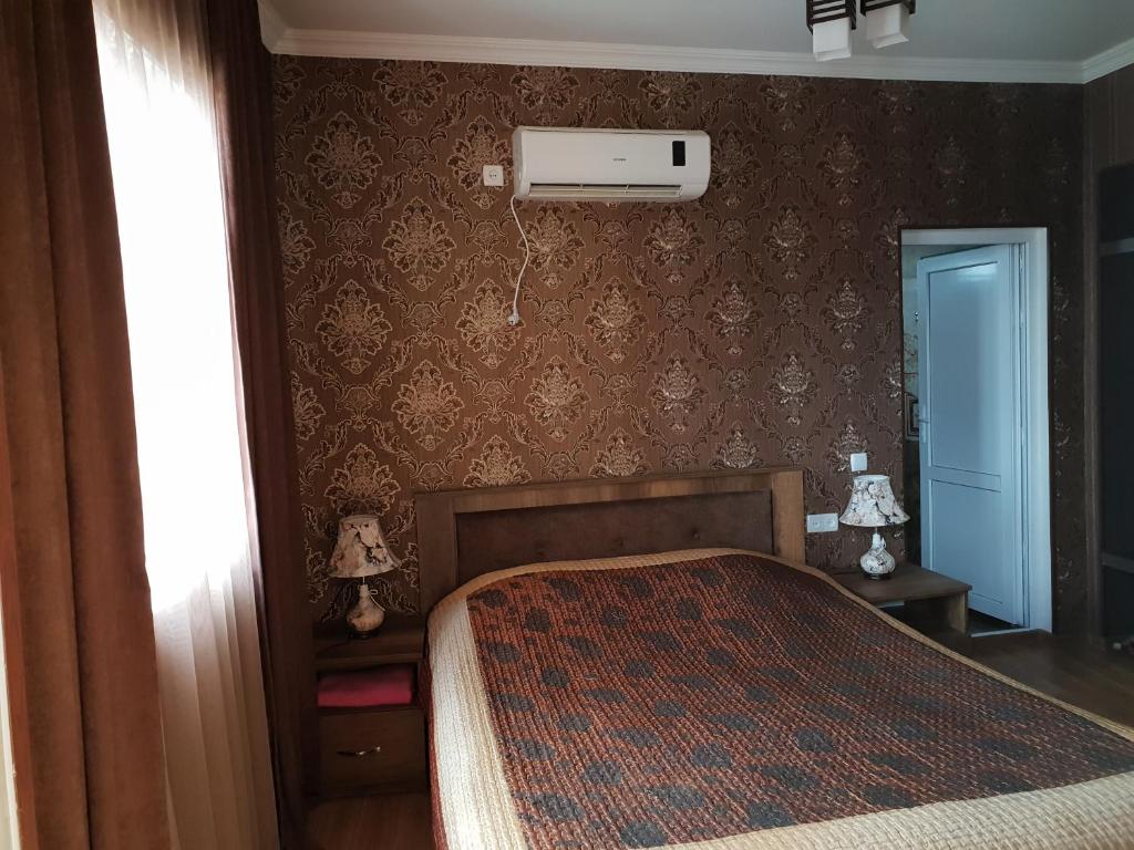 Postel nebo postele na pokoji v ubytování Guest House Kusika