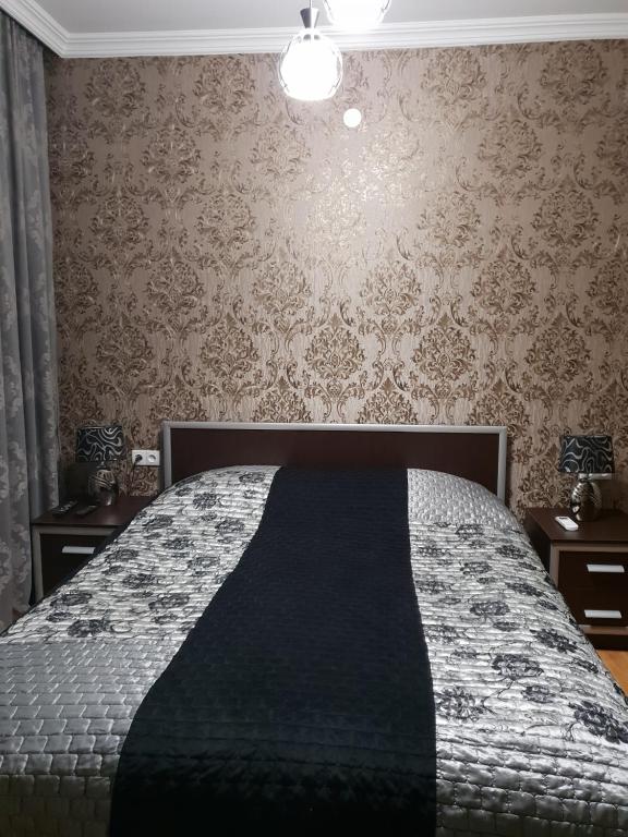 Postel nebo postele na pokoji v ubytování Guest House Kusika