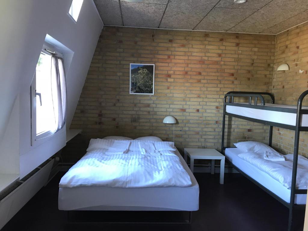 Postel nebo postele na pokoji v ubytování Oasen Samsø