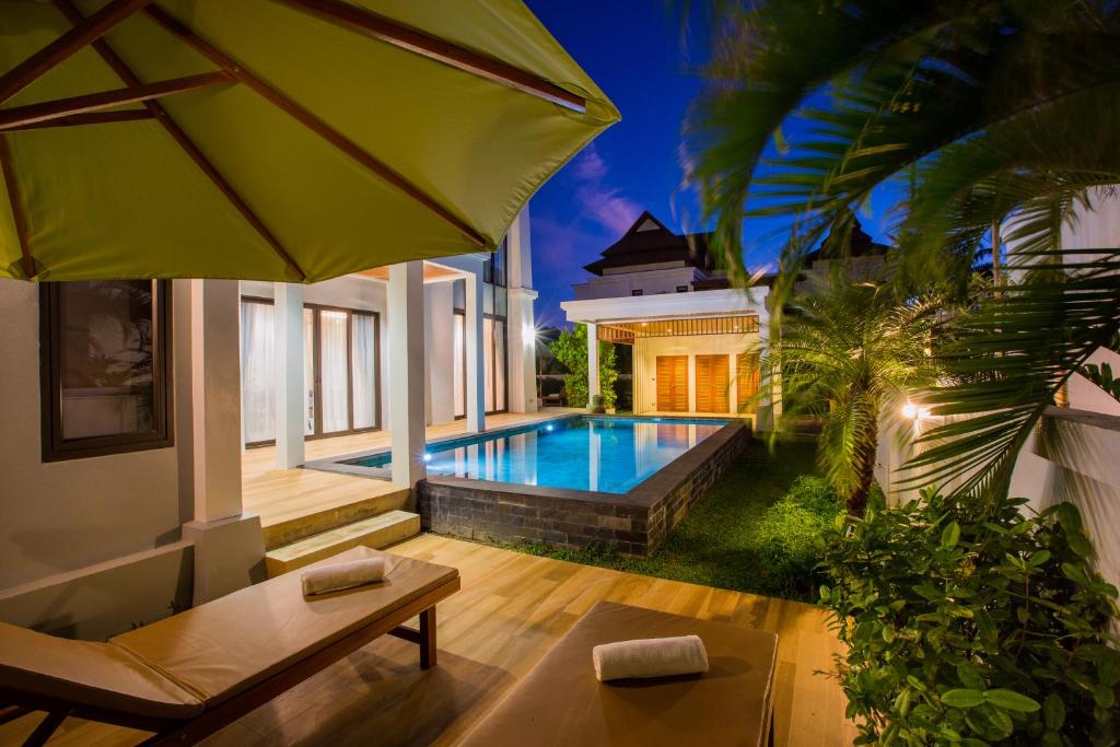 a villa with a swimming pool in a backyard at Villa Palavee (A2) in Ao Nang Beach