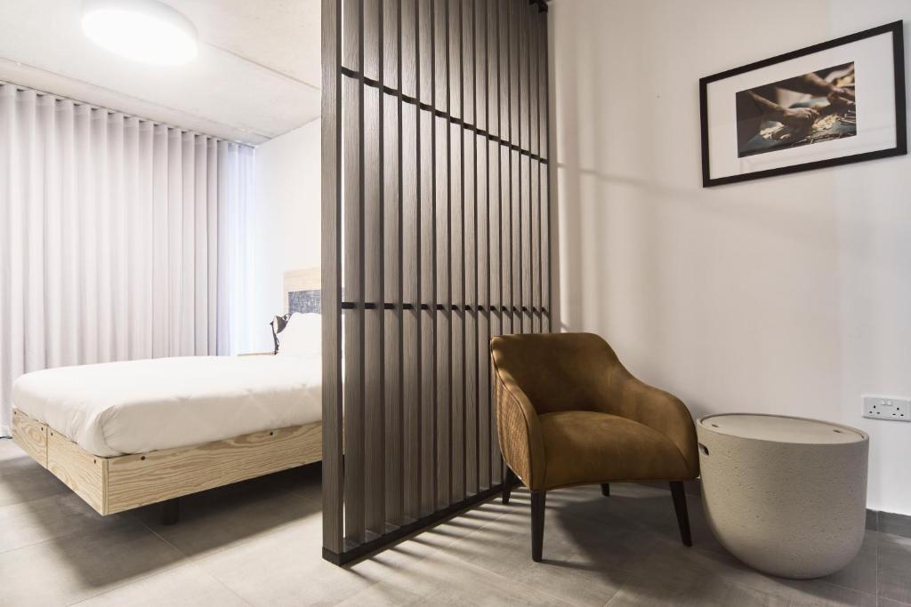 Postel nebo postele na pokoji v ubytování Mr Todd Hotel