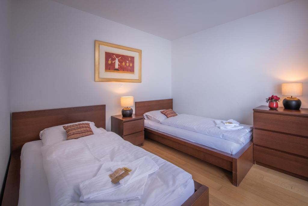 Postel nebo postele na pokoji v ubytování Chalet Roossi 3