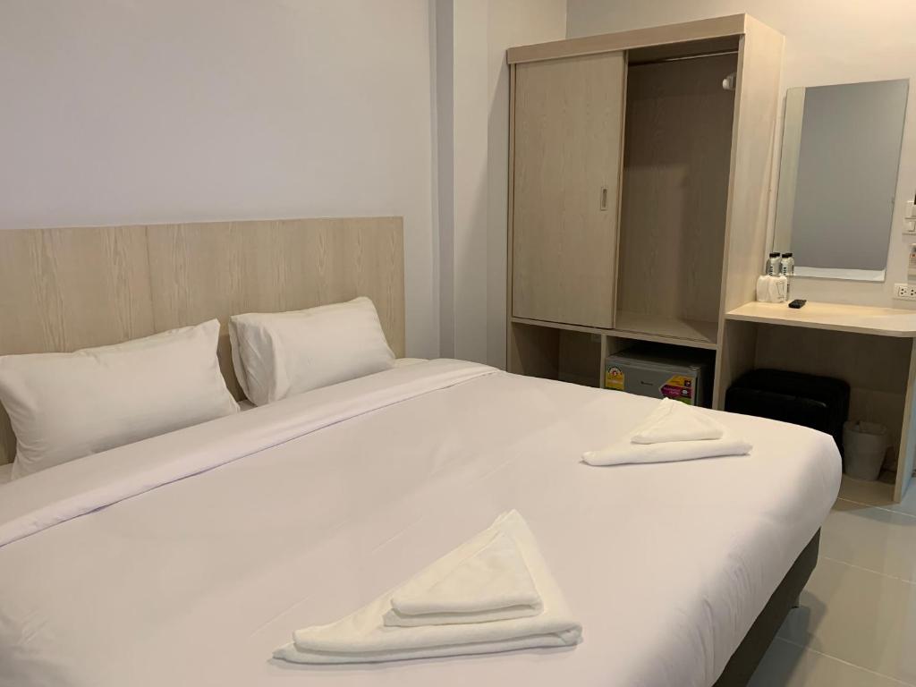Postel nebo postele na pokoji v ubytování Chiangmun Boutique