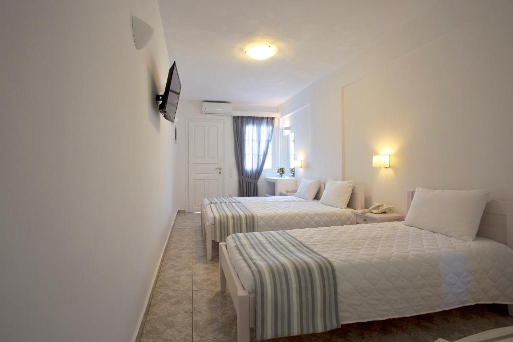 Postel nebo postele na pokoji v ubytování Alexandra Hotel