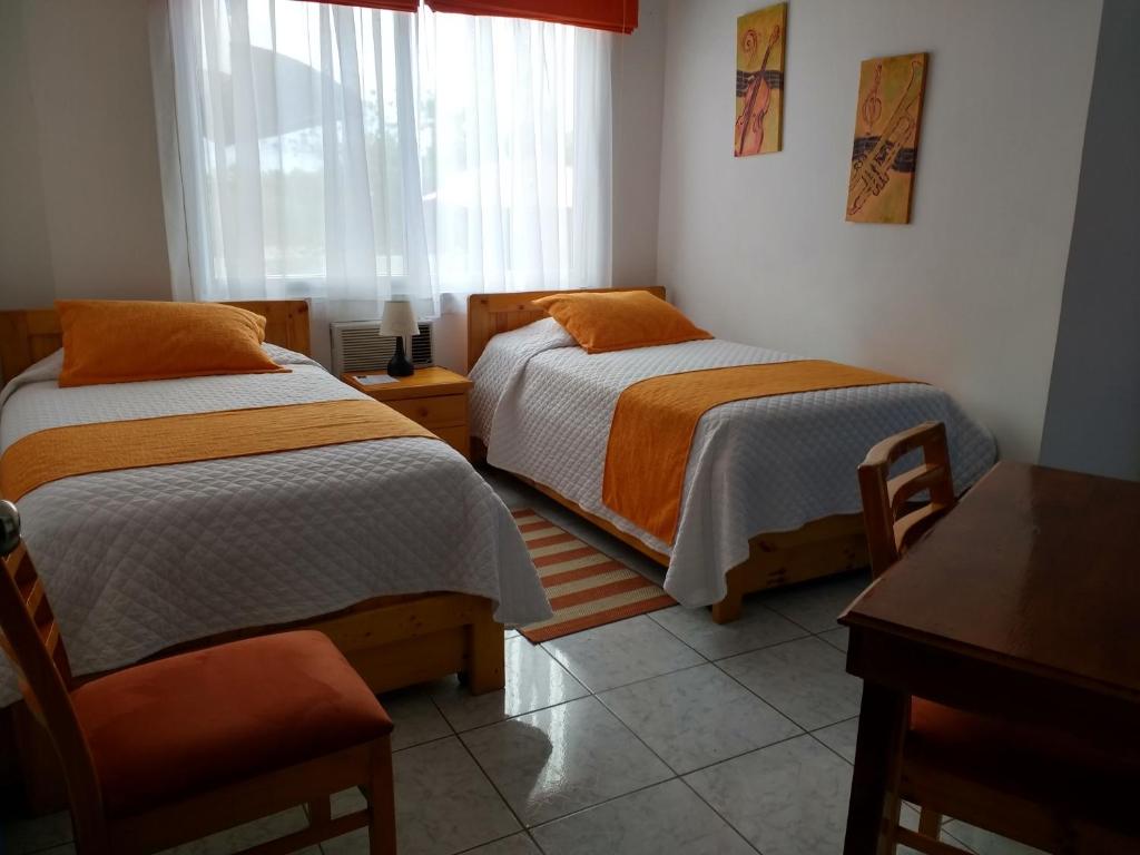 Postel nebo postele na pokoji v ubytování Drake Inn