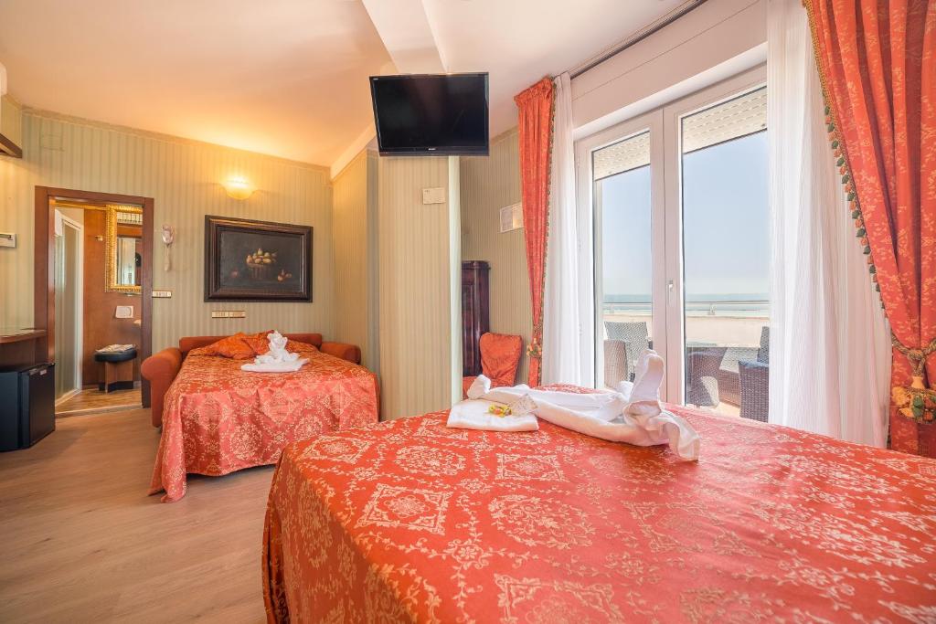 Postel nebo postele na pokoji v ubytování Hotel Des Nations - Vintage Hotel sul mare