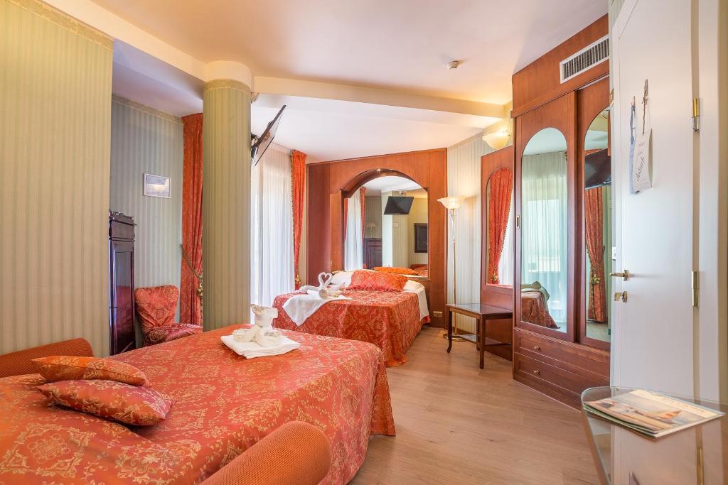 Postel nebo postele na pokoji v ubytování Hotel Des Nations - Vintage Hotel sul mare
