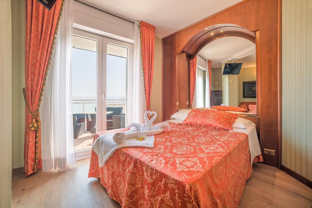Postel nebo postele na pokoji v ubytování Hotel Des Nations - Vintage Hotel sul mare