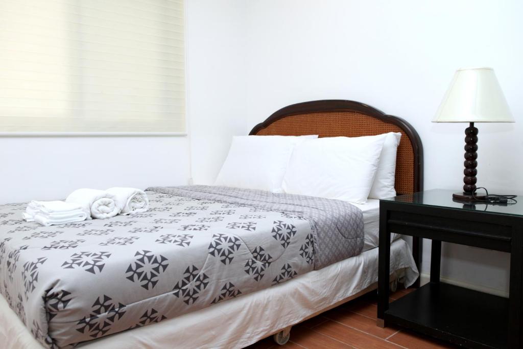 Postel nebo postele na pokoji v ubytování Centtro Residences