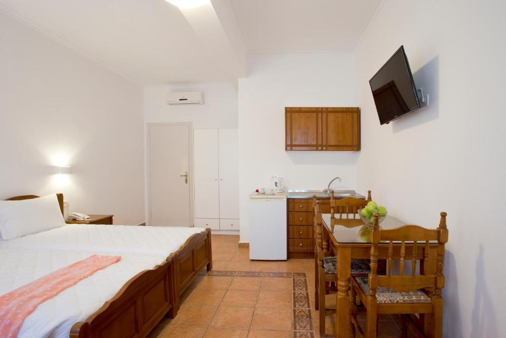 Postel nebo postele na pokoji v ubytování Alexandra Hotel