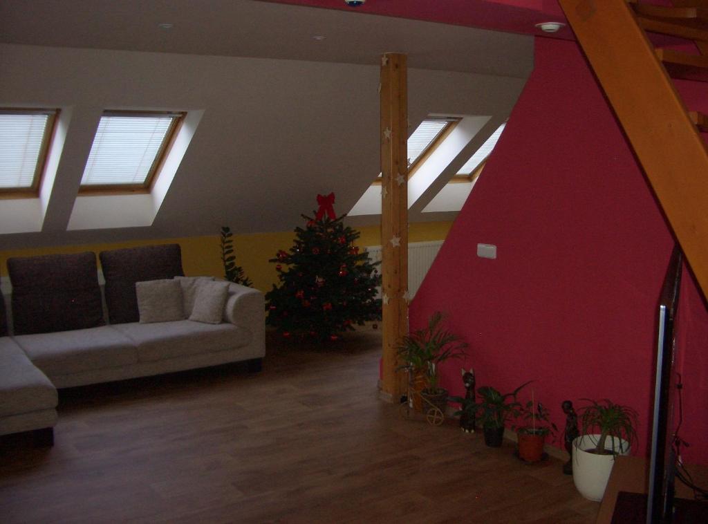 a living room with a christmas tree and a couch at Apartment Mikulov, Husova Ulice in Mikulov