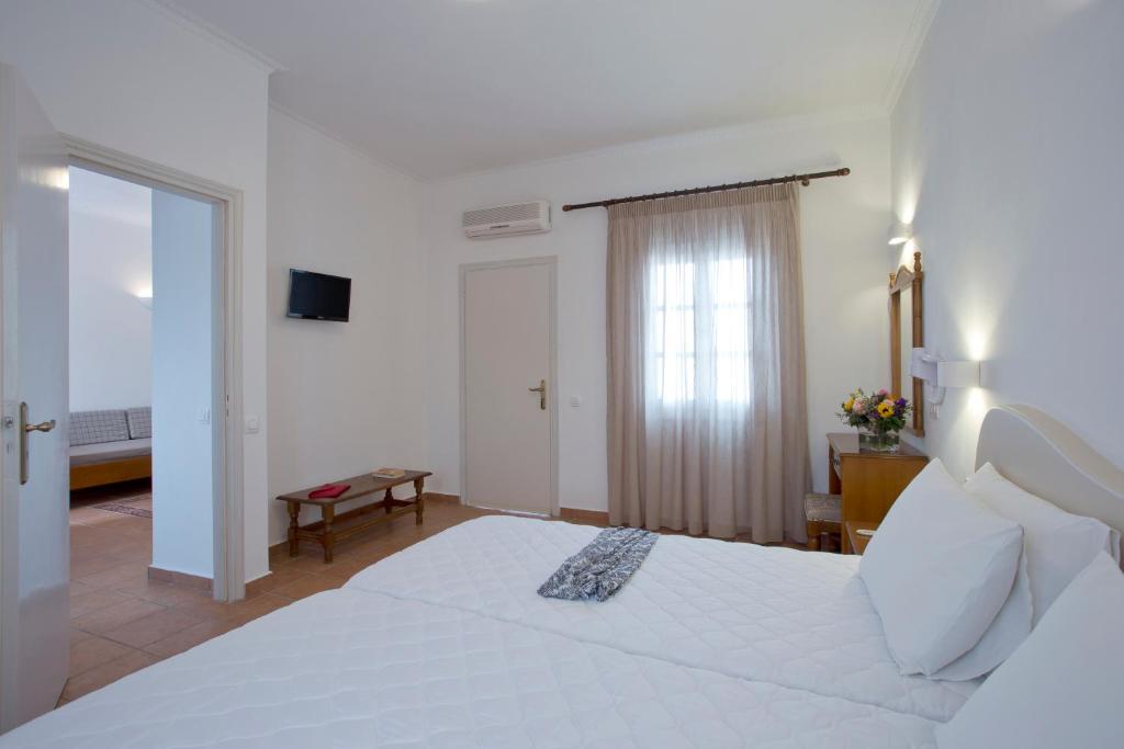 Postel nebo postele na pokoji v ubytování Alexandra Hotel