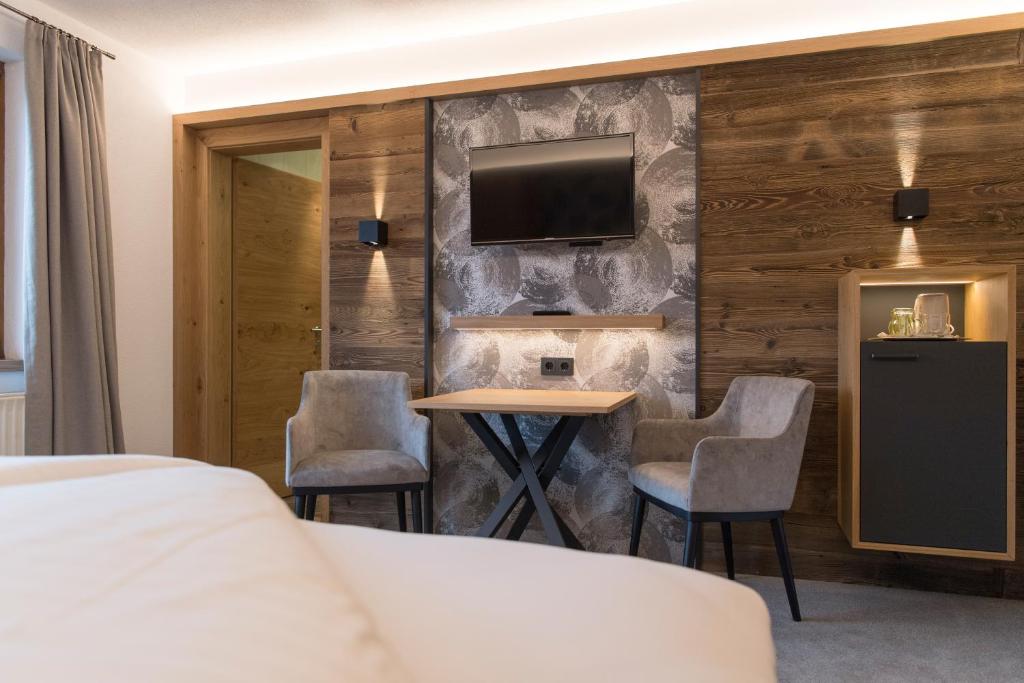 Postel nebo postele na pokoji v ubytování Hotel Garni Feuerstein