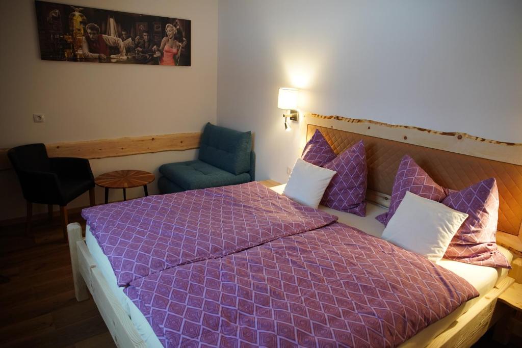 A bed or beds in a room at Alpenapartments Steiermark