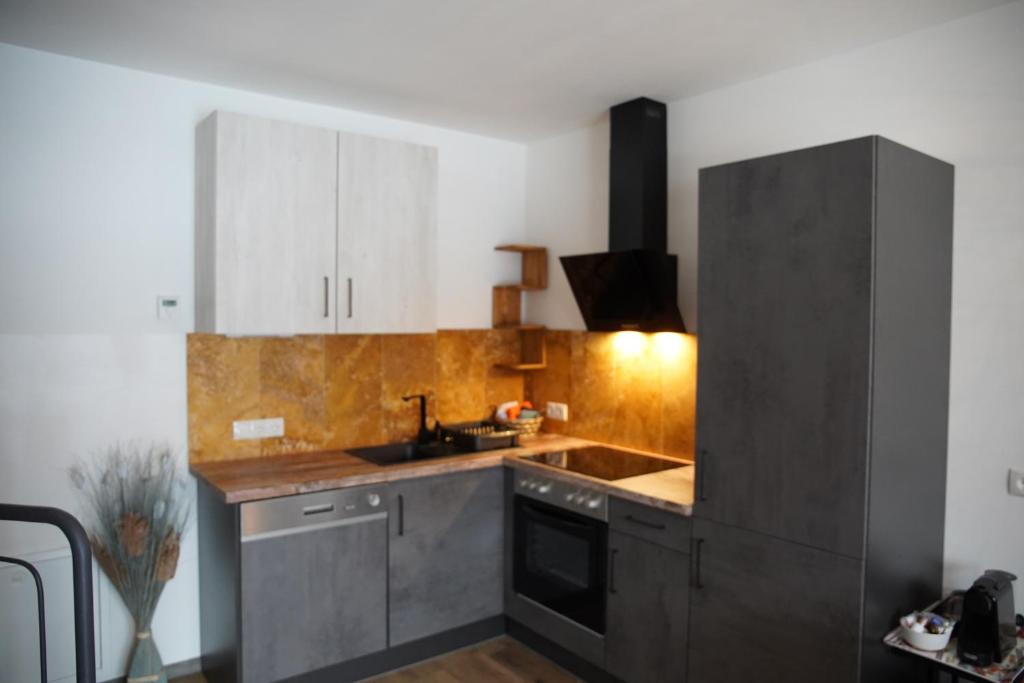 A kitchen or kitchenette at Alpenapartments Steiermark