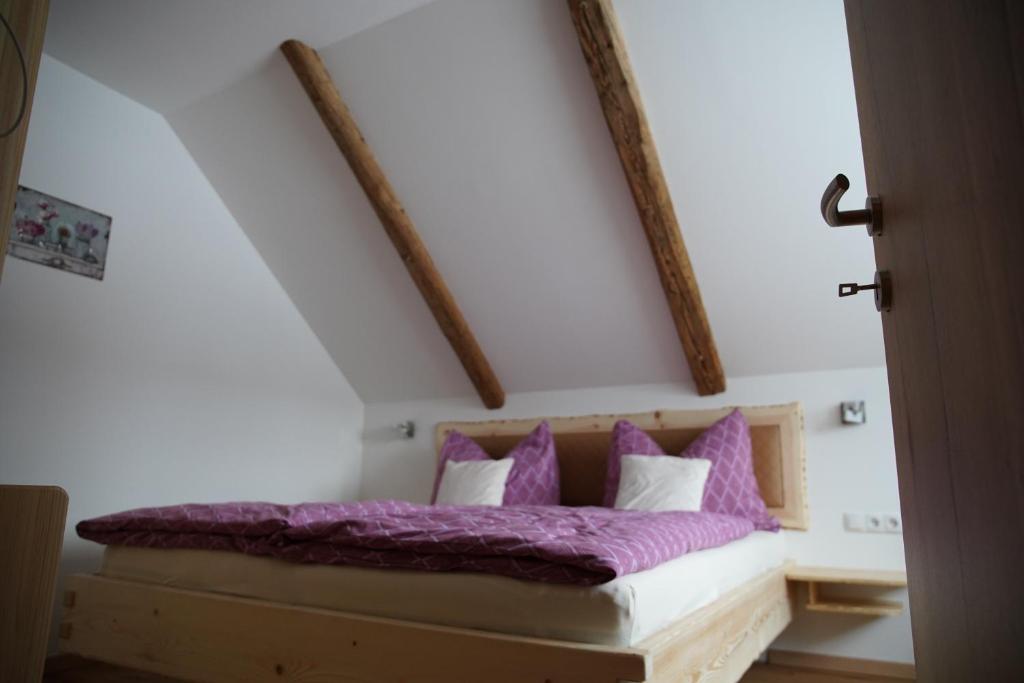 A bed or beds in a room at Alpenapartments Steiermark