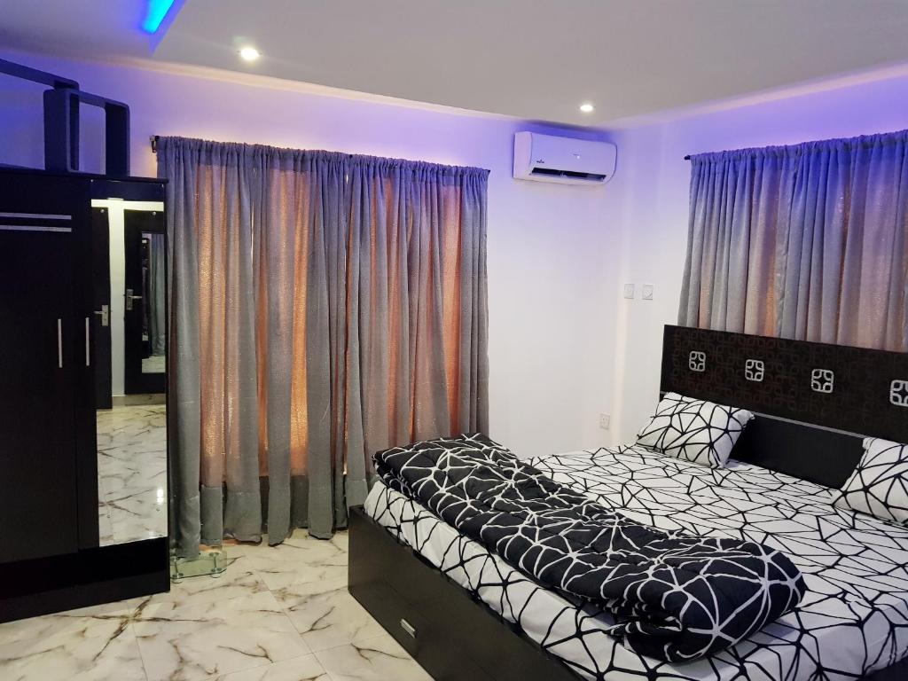 Postel nebo postele na pokoji v ubytování CG Apartments Metro