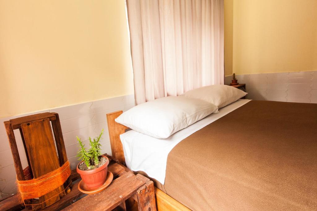 Postel nebo postele na pokoji v ubytování Papachos Hostel