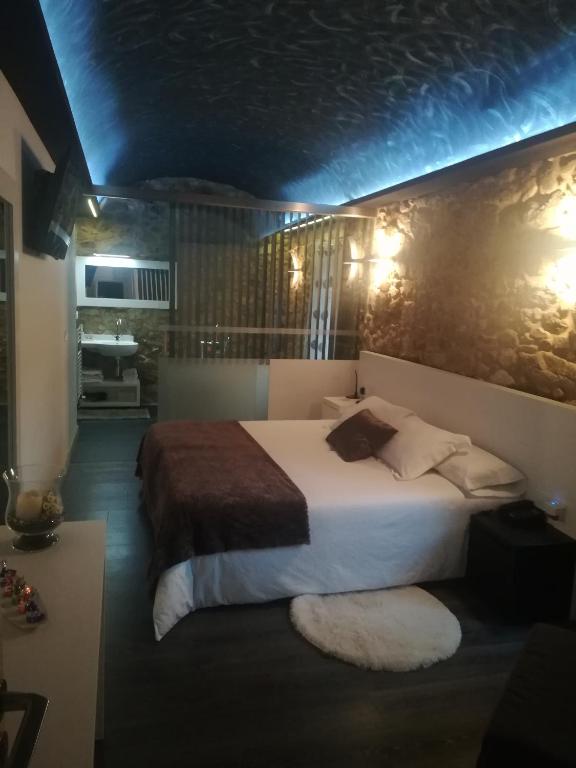 Ένα ή περισσότερα κρεβάτια σε δωμάτιο στο Casa O Gures