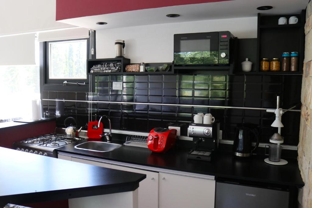 Kuchyň nebo kuchyňský kout v ubytování Limay Bed&Breakfast