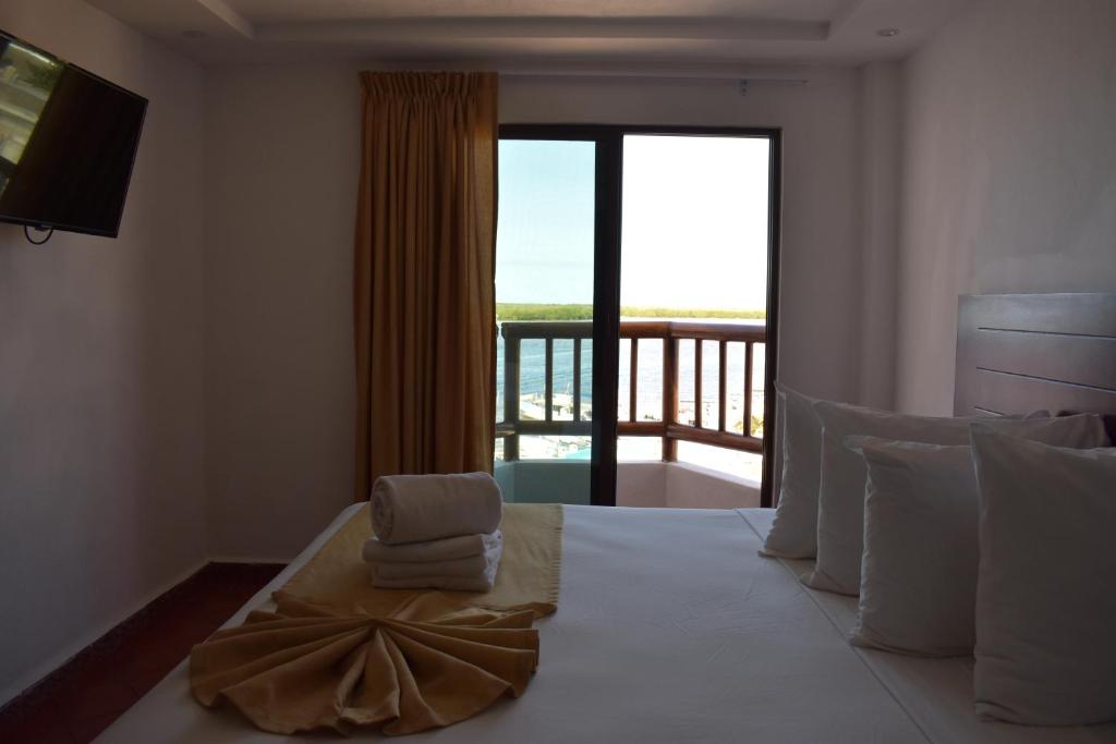 Postel nebo postele na pokoji v ubytování Hotel Rio Lagartos
