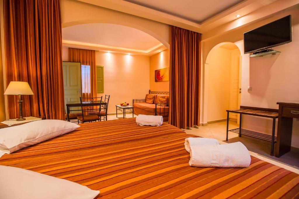 Postel nebo postele na pokoji v ubytování Anassa Deluxe Suites