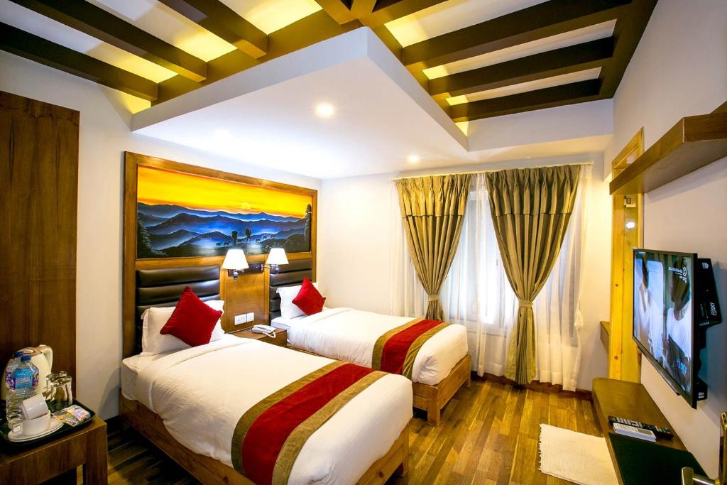 Postel nebo postele na pokoji v ubytování Beautiful Kathmandu Hotel