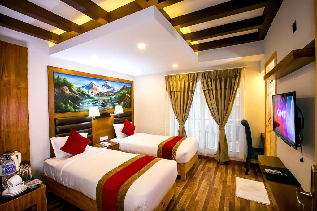 Postel nebo postele na pokoji v ubytování Beautiful Kathmandu Hotel
