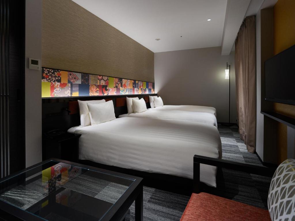 Postel nebo postele na pokoji v ubytování Mitsui Garden Hotel Kanazawa