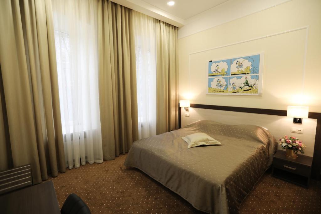 Postel nebo postele na pokoji v ubytování Hotel Donald