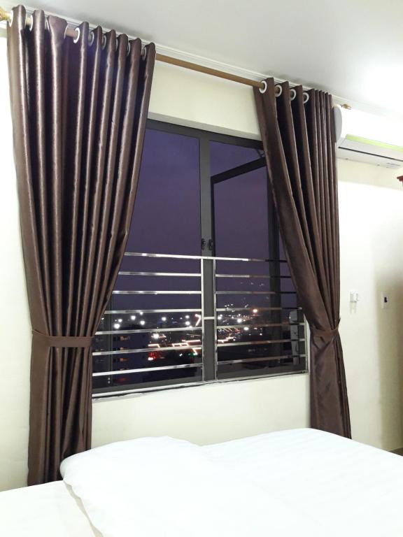 Uma cama ou camas num quarto em Guesthouse Anh Khang