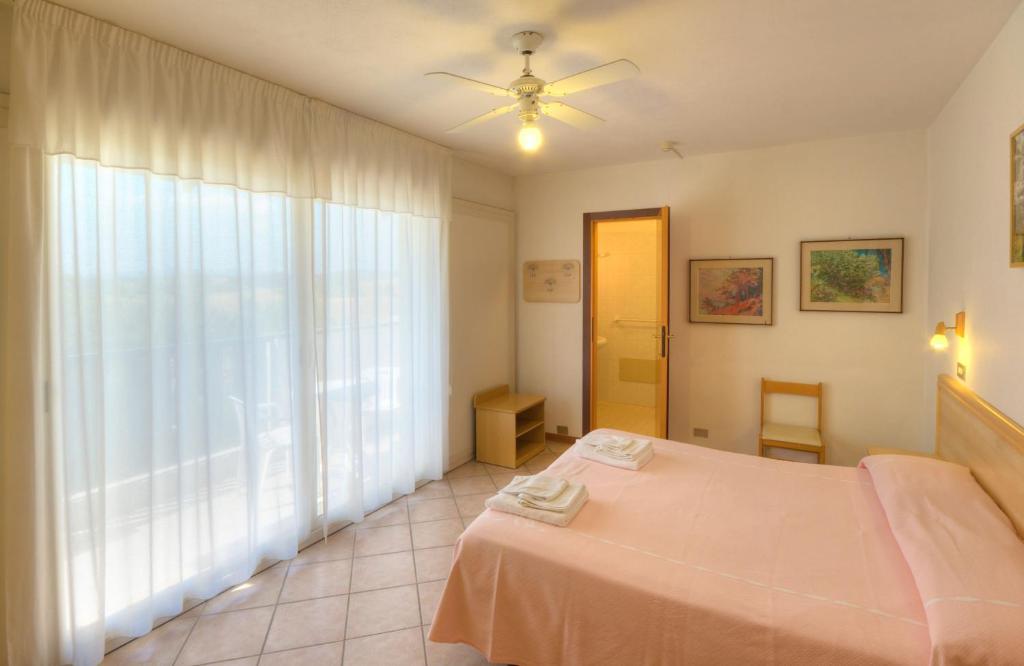 Postel nebo postele na pokoji v ubytování Hotel K2