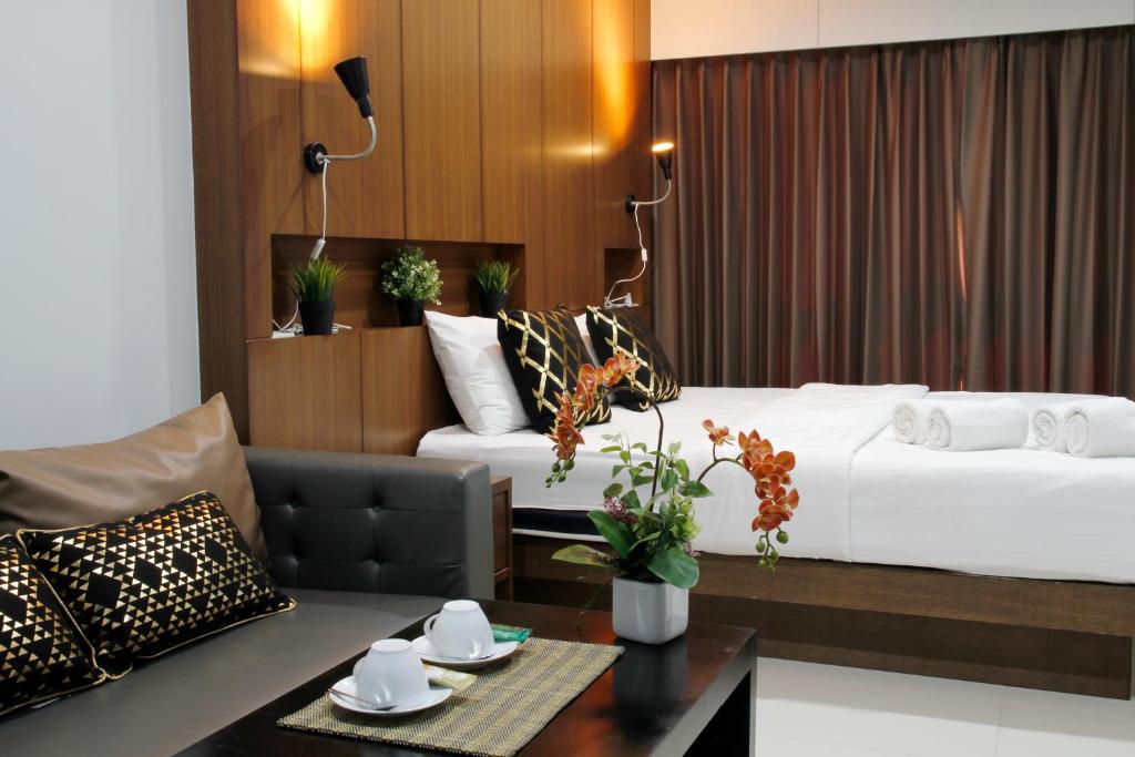 מיטה או מיטות בחדר ב-Bangkok Boutique Resort Rangsit