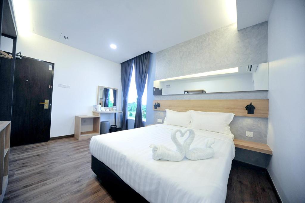 Postel nebo postele na pokoji v ubytování MYe Hotel