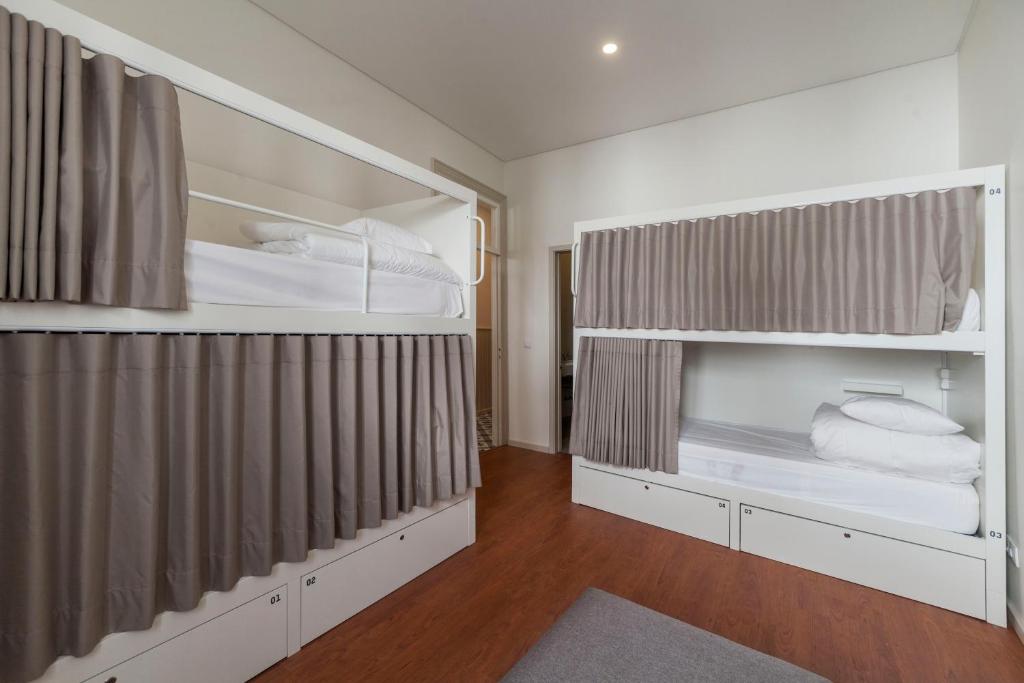 Postel nebo postele na pokoji v ubytování A Bica Hostel
